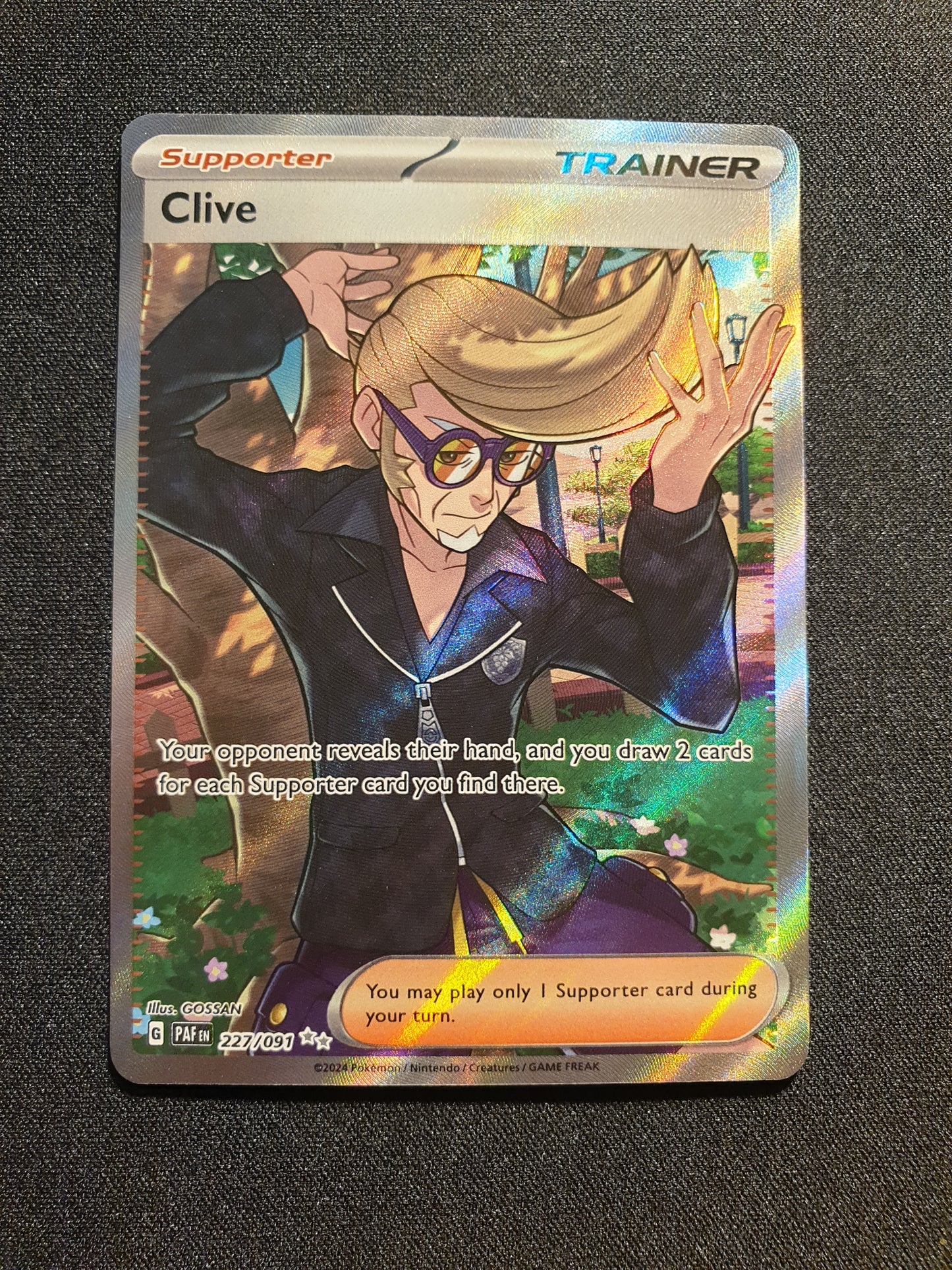 Clive 227/091 (Mint Condition) - Paldean Fates - TCG Trainers